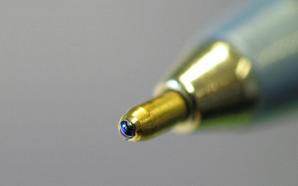 Close-Up Ballpoint Pen Tip Wallpaper: Precision & Smooth Texture