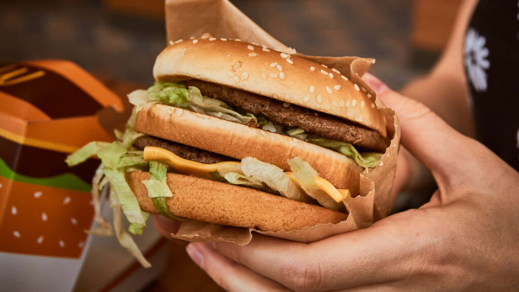 Close-Up of McDonald's Burger with Fresh Toppings - Wallpaper Background