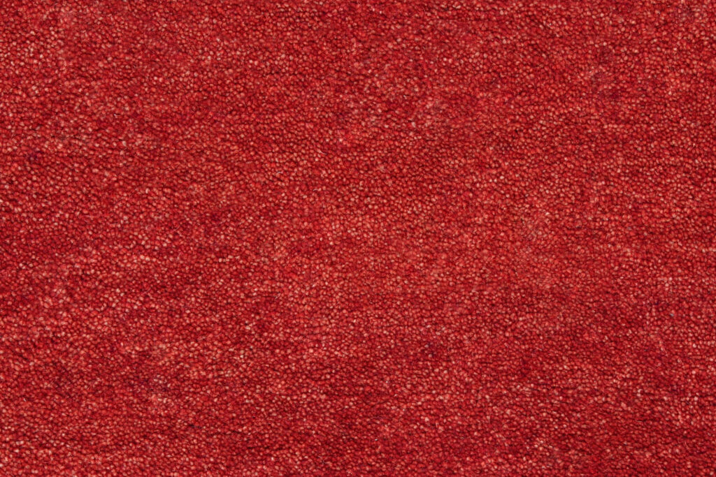Luxurious Red Wool Carpet Close-Up: Warmth & Texture for Interiors Wallpaper