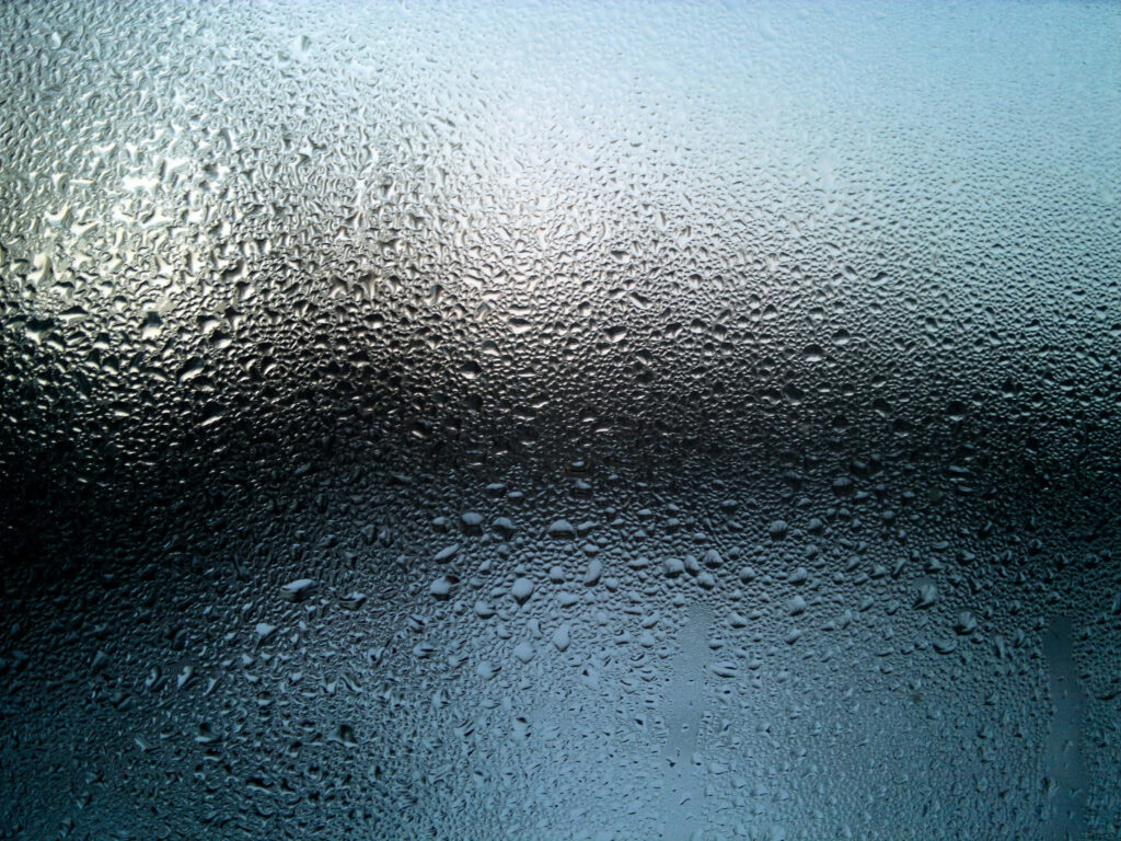Close-Up of Water Droplets on Glass: Textured Gradient Wallpaper