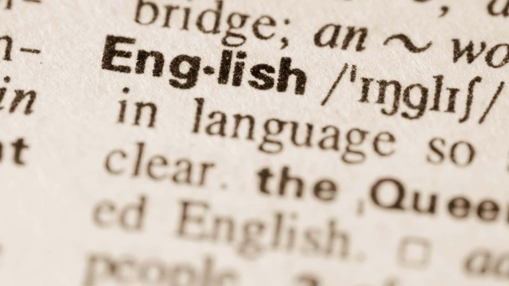 Macro photo of English dictionary definition highlighting language and typography details Wallpaper