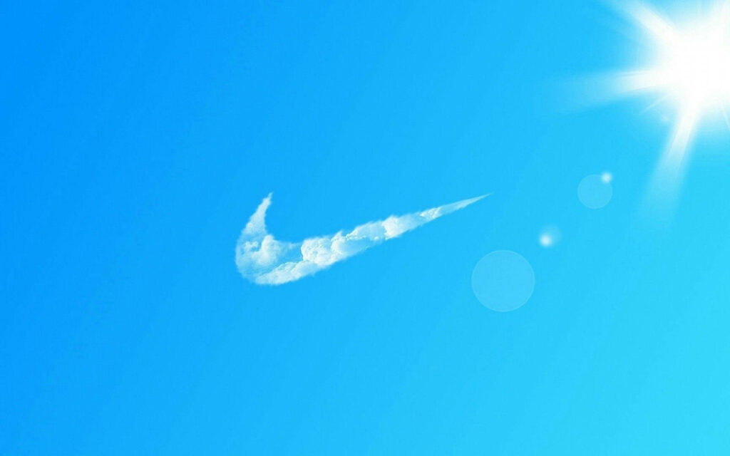 Celestial Serenity: Nike Logo Transformed into Whimsical Daytime Cloudscape Wallpaper