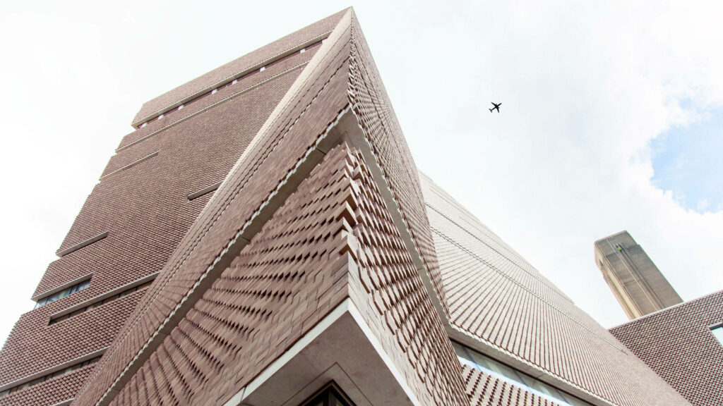 Sky-high View: Tate Modern's Stunning Architecture at a Low Angle Wallpaper