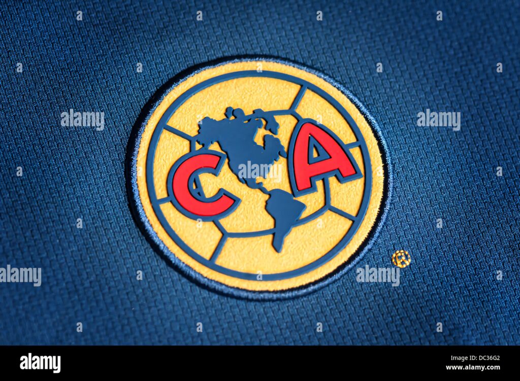 Club América wallpaper with yellow blue crest map of Americas and bold red CA on dark blue background