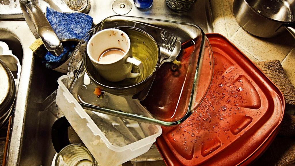Messy Kitchen Sink: Dirty Dishes & Utensils After a Meal Wallpaper