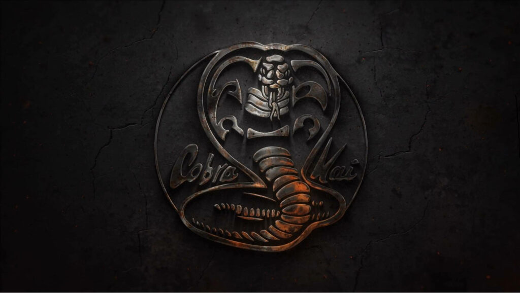 Cobra Kai Phone Wallpaper: Iconic Logo on Dark Textured Background