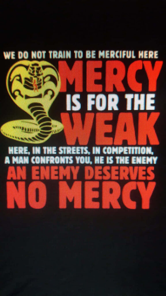 Bold Cobra Kai Wallpaper: 'Mercy is for the Weak' Design
