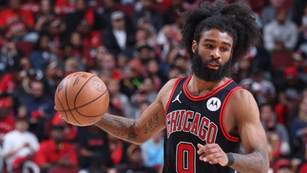 Coby White Chicago Bulls basketball player mid-action in vibrant red and black jersey on court Wallpaper
