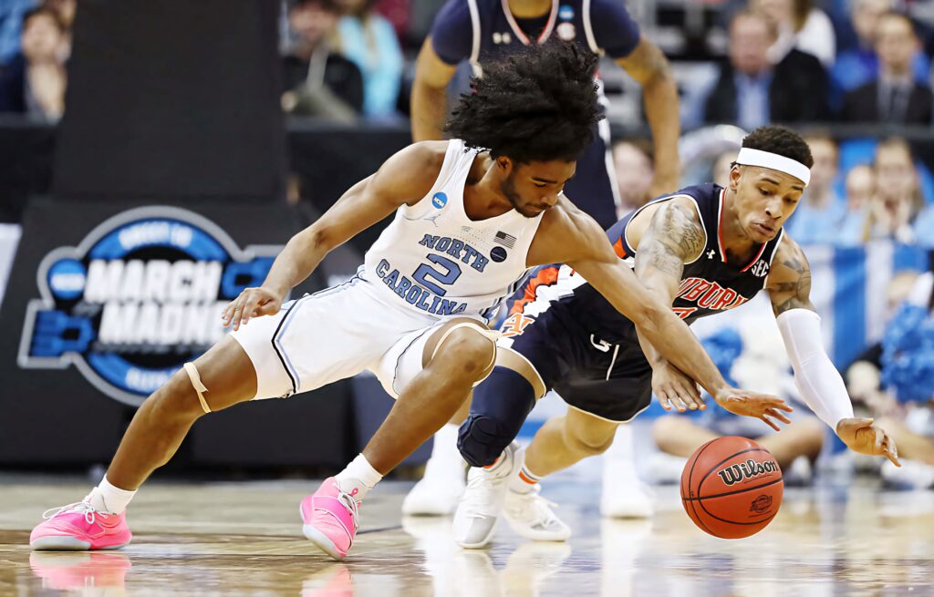 Coby White in action basketball wallpaper North Carolina player intense college game focus
