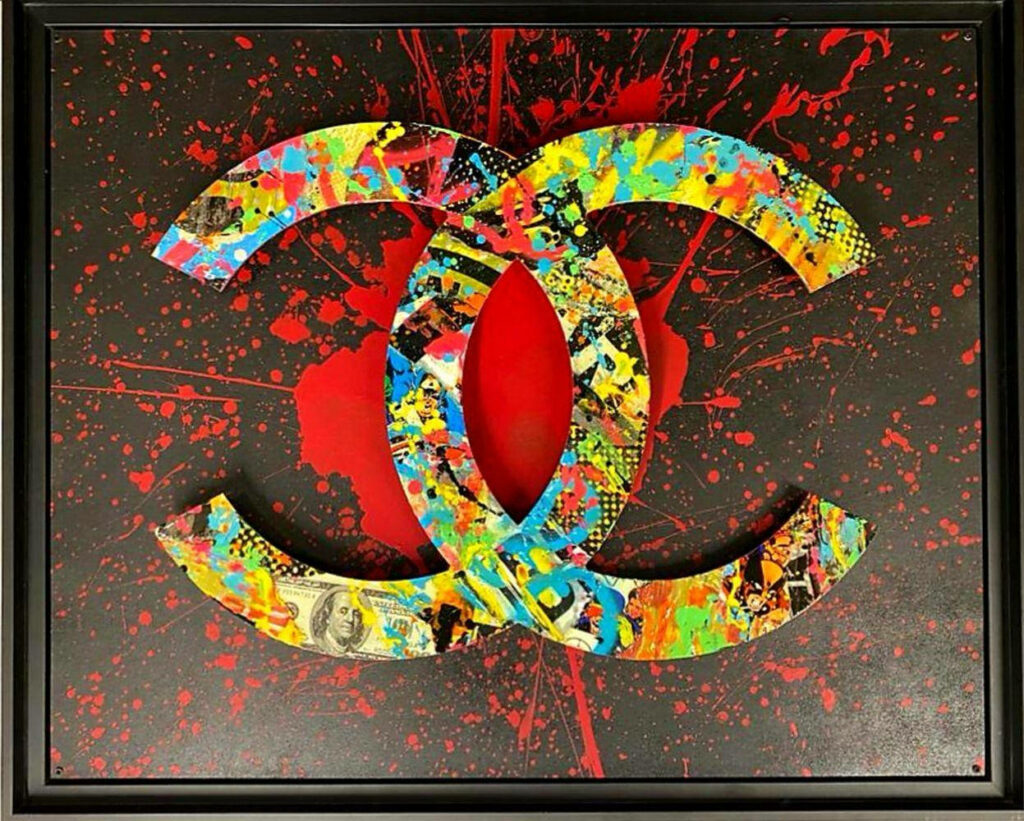 Coco Chanel's Iconic Monogram Transformed into Abstract Designer Art: A Vibrant Homage with Paint-Splattered Emblem Wallpaper