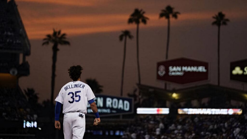 Cody Bellinger at Dodger Stadium sunset with palm tree silhouettes iconic baseball wallpaper