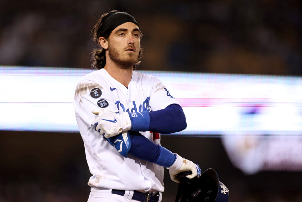 Cody Bellinger in Dodgers uniform with dirt marks showing intense focus on baseball field background Wallpaper