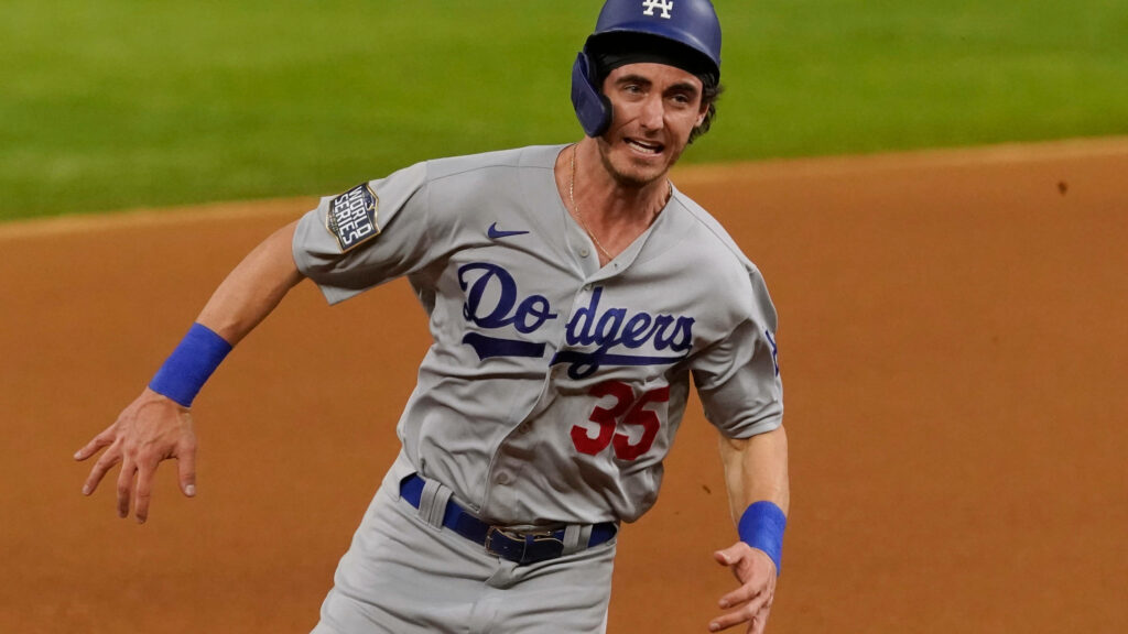 Cody Bellinger running on Dodgers baseball field mid-action intense focus high resolution wallpaper