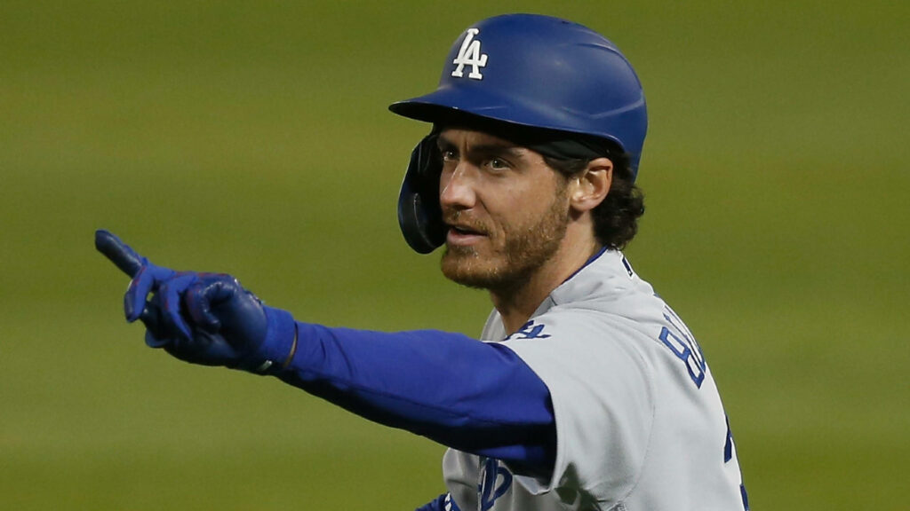 Cody Bellinger in Dodgers uniform pointing with focus during intense baseball game action shot Wallpaper