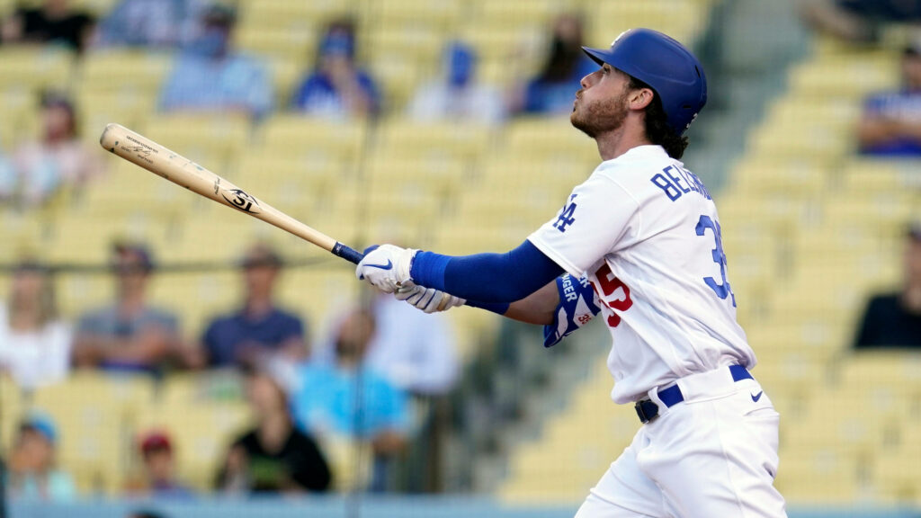 Cody Bellinger mid-swing Dodgers outfielder dynamic wallpaper sunlit stadium baseball action