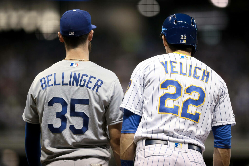 MLB stars Cody Bellinger and Christian Yelich side by side in team uniforms baseball wallpaper background