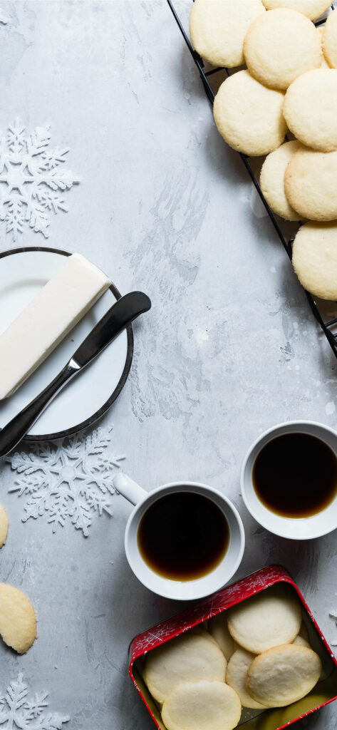 Biscuit Bliss: A Delectable Cookie Tray with Coffee and Butter Charming iPhone Background Wallpaper