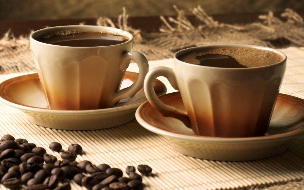 Cozy Coffee Cups Wallpaper: Ceramic Cups & Beans for Warm Ambiance