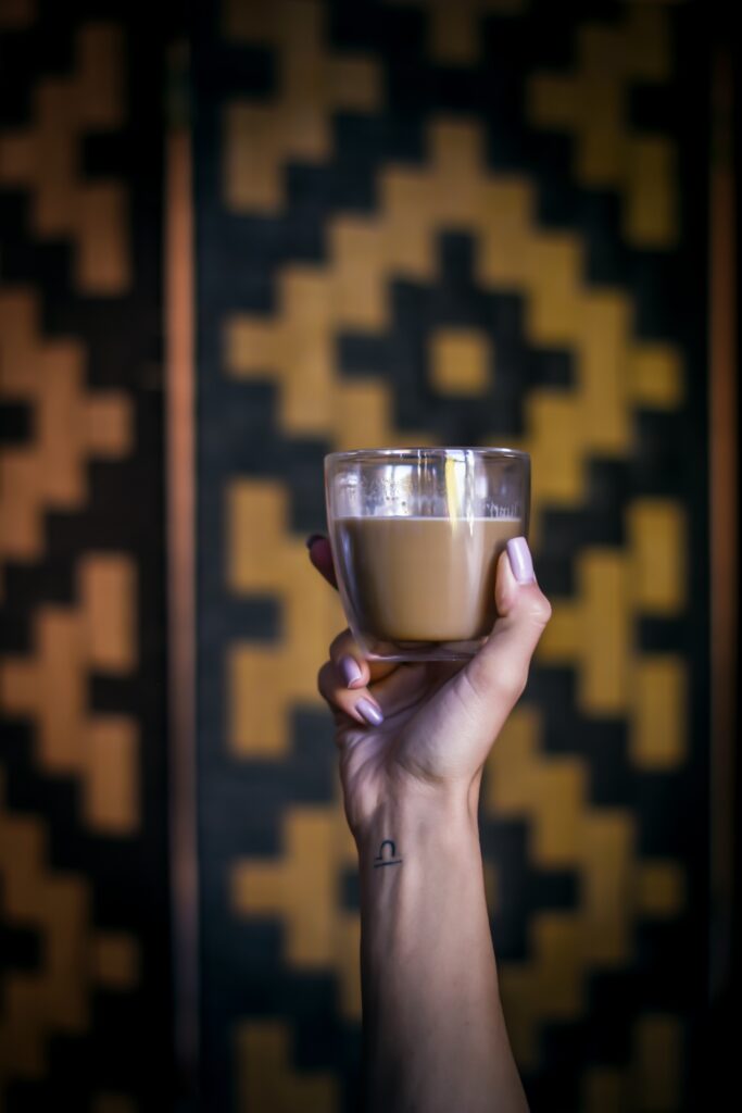Coffee in Hand: Geometric Pattern Wallpaper Background