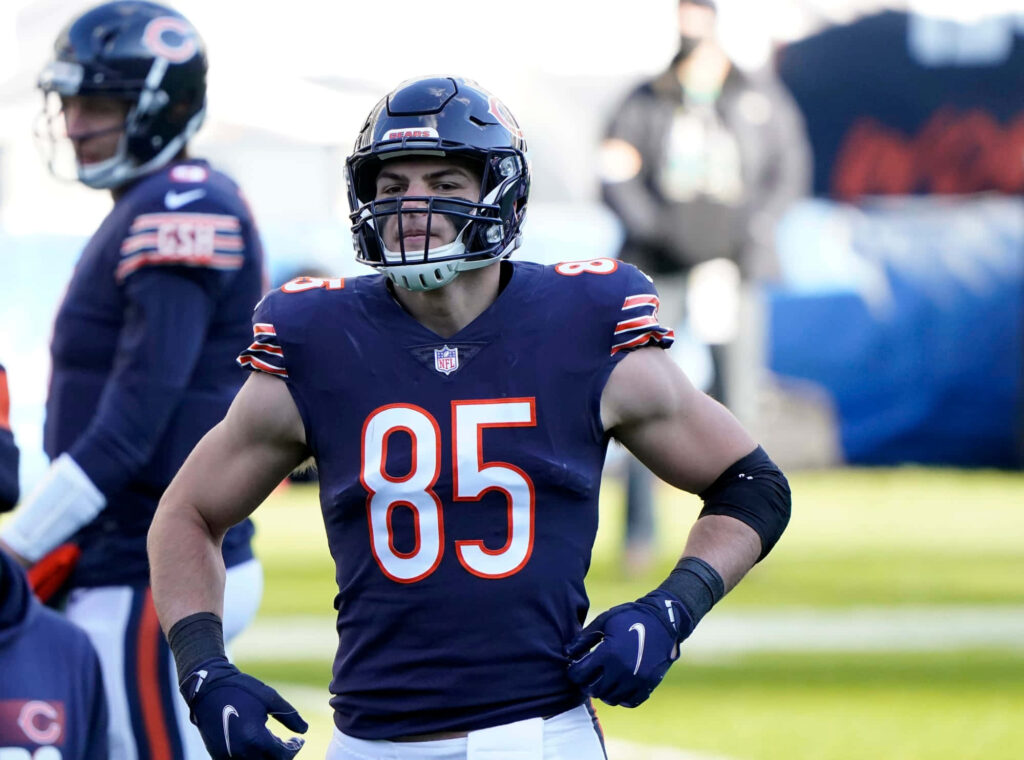 Chicago Bears Cole Kmet number 85 in full uniform on field showcasing athletic build and focus Wallpaper