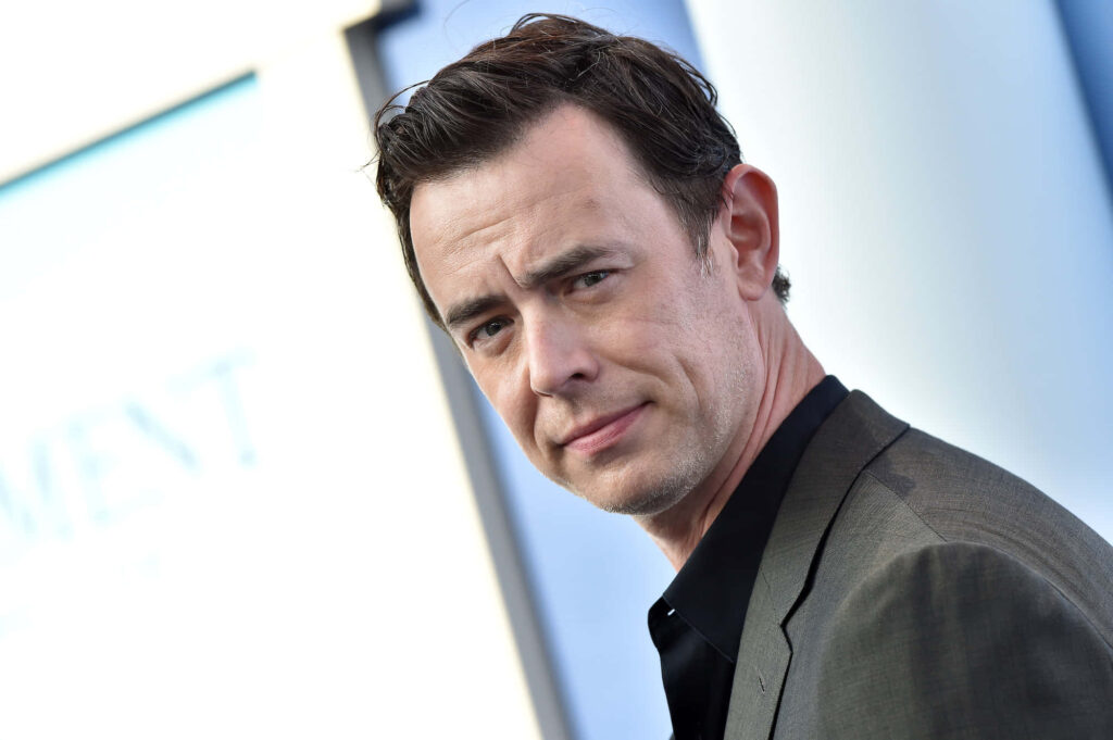 Colin Hanks portrait in sharp suit with modern cool tone background high resolution wallpaper
