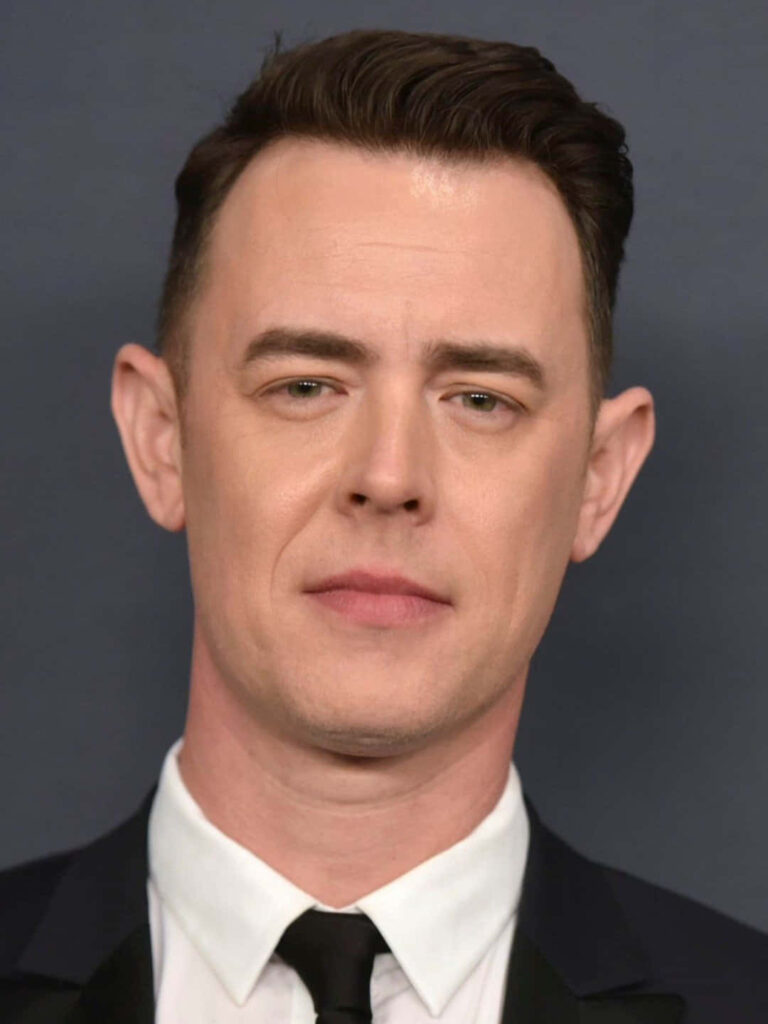 Colin Hanks sharp portrait in formal suit dark background professional celebrity wallpaper