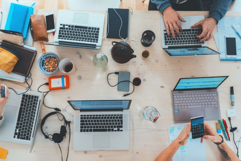 Dynamic Collaborative Workspace: Tech Gadgets & Laptops Wallpaper