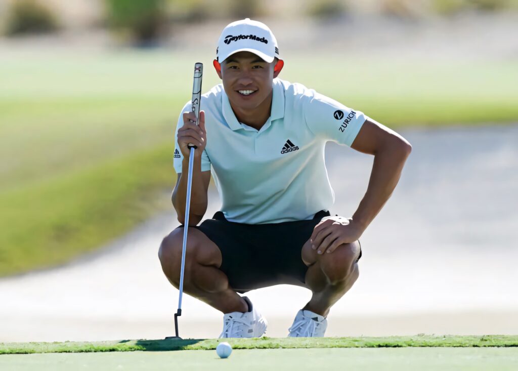 Collin Morikawa squatting on green golf course focused with putter professional golf athlete Wallpaper