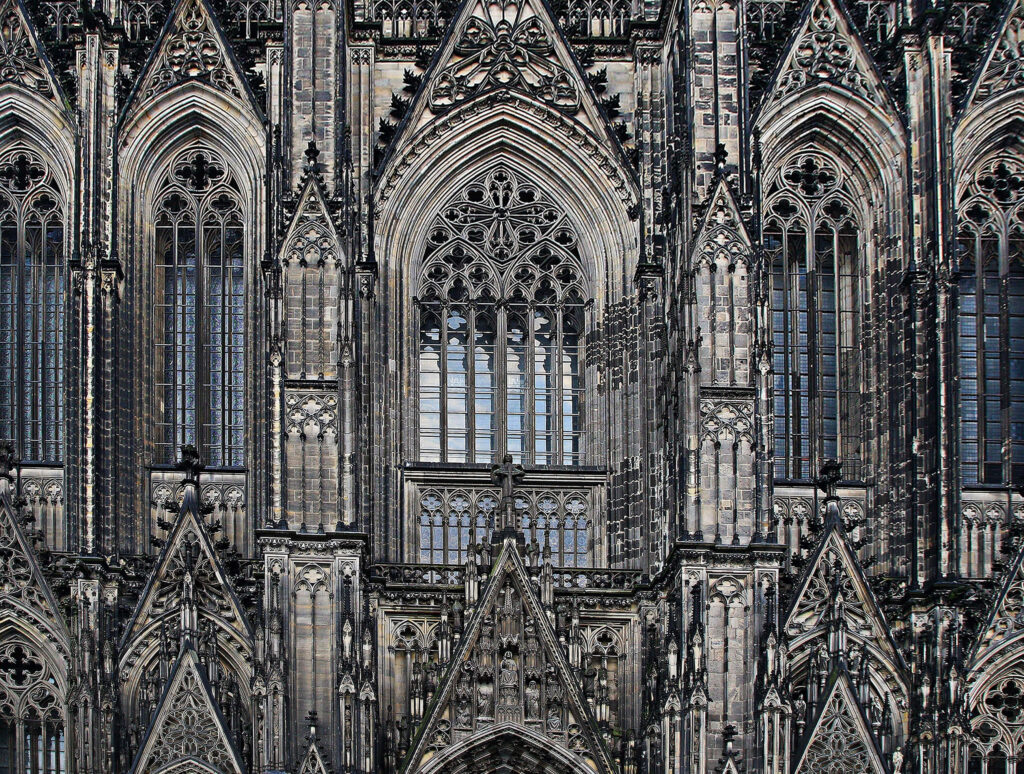 Cologne Cathedral gothic architecture wallpaper detailed stone carvings pointed arches gray tones
