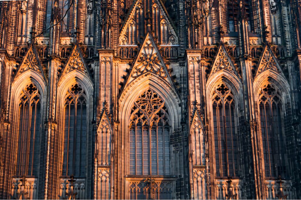 Cologne Cathedral Gothic architecture with ornate spires pointed arches detailed stonework wallpaper