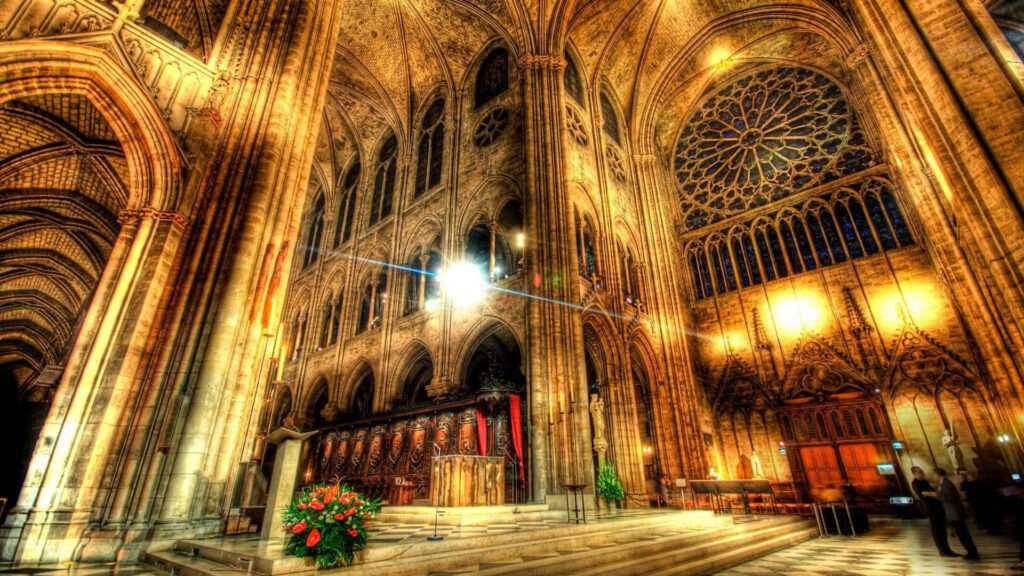 Cologne Cathedral interior with soaring Gothic arches stained glass windows and detailed stonework Wallpaper