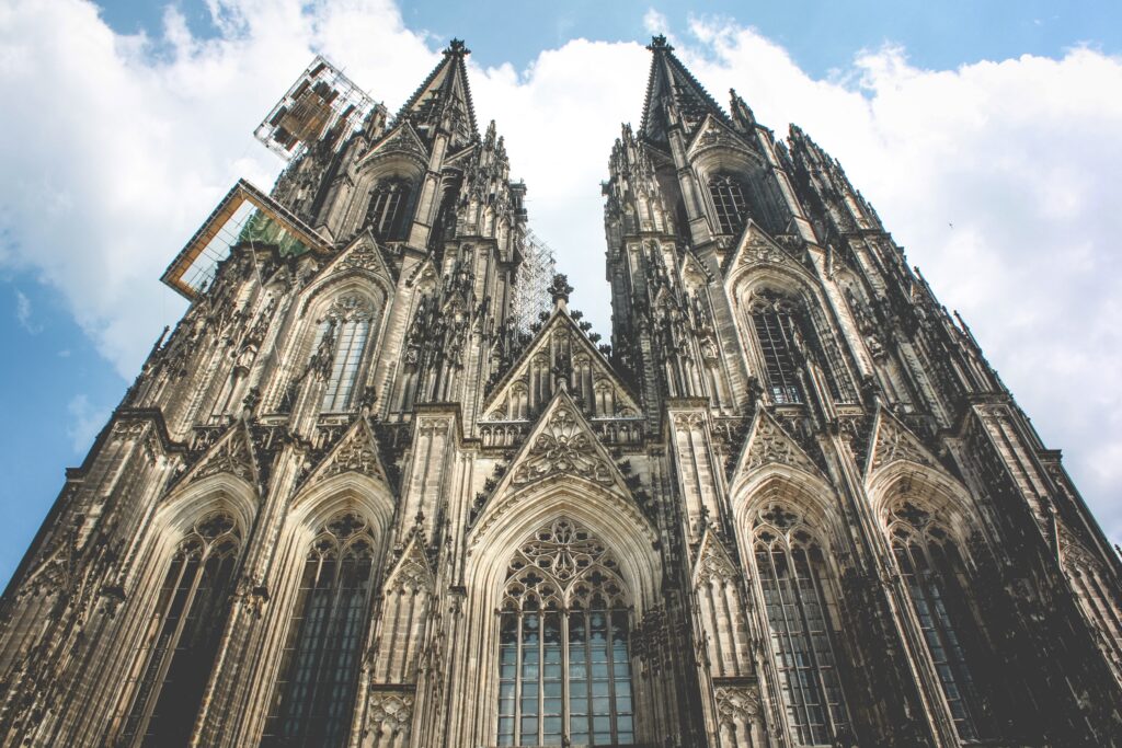 Majestic Cologne Cathedral Wallpaper: Gothic Architecture & Blue Sky