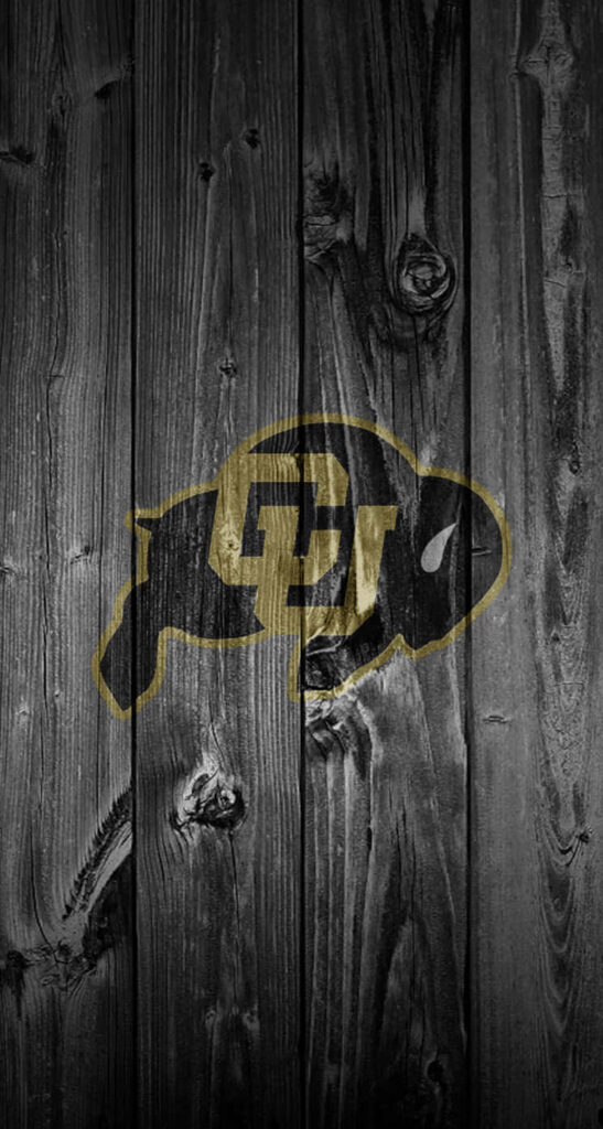 Colorado Buffaloes logo on dark weathered wood background rustic sports wallpaper design
