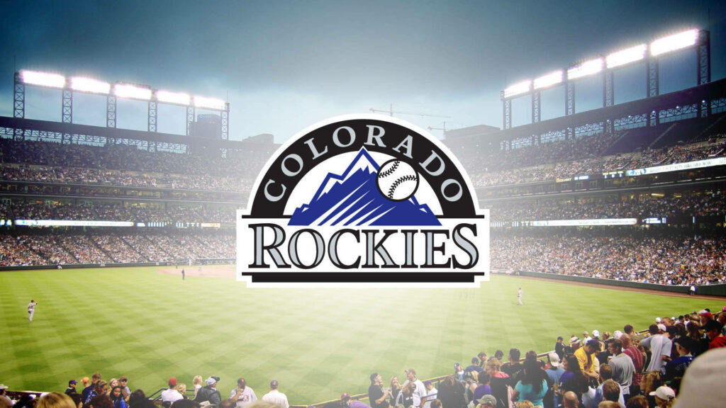 Colorado Rockies logo with vibrant packed stadium evening sky MLB baseball game wallpaper