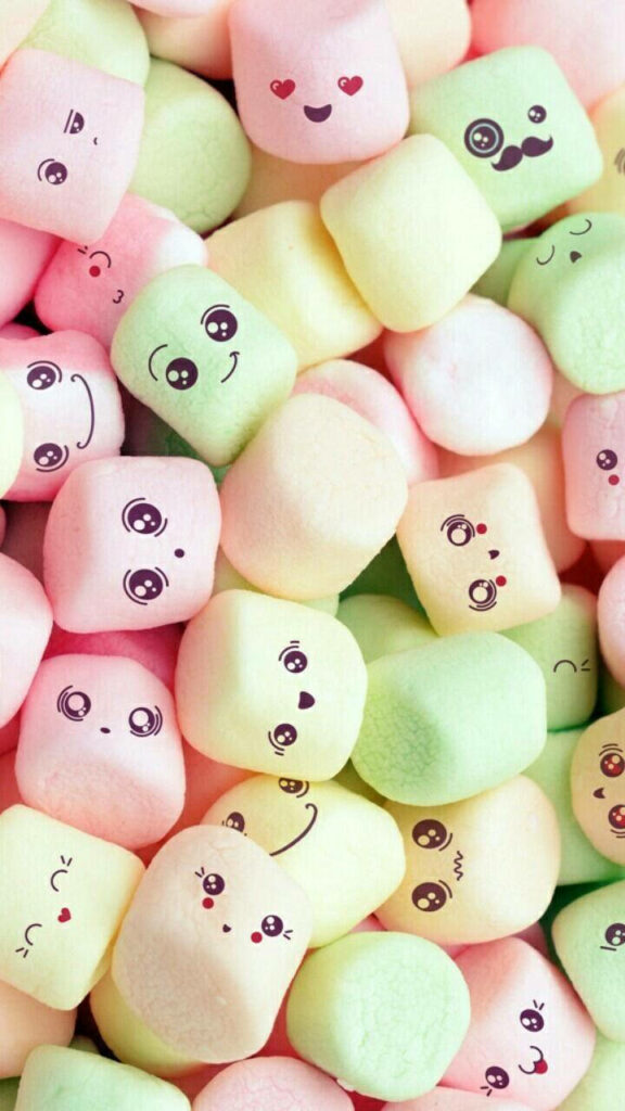 Playful 3D pastel pink yellow green marshmallows with cute cartoon faces colorful phone wallpaper
