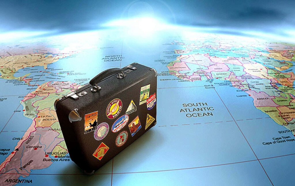 Colorful 3D Suitcase Wallpaper: Adventure & Wanderlust Background