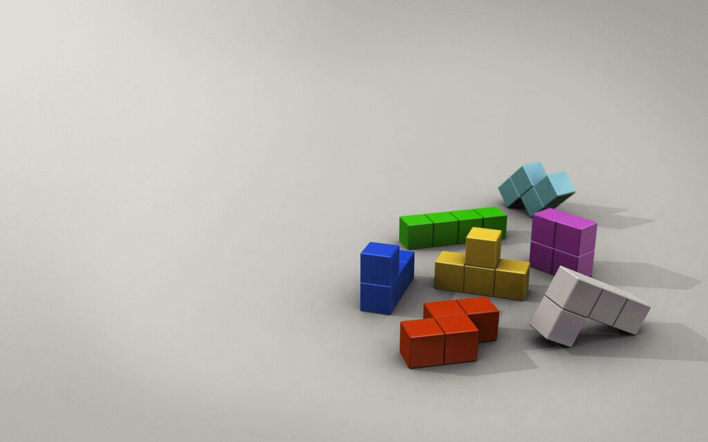 Colorful 3D Tetris Blocks Wallpaper on Neutral Background