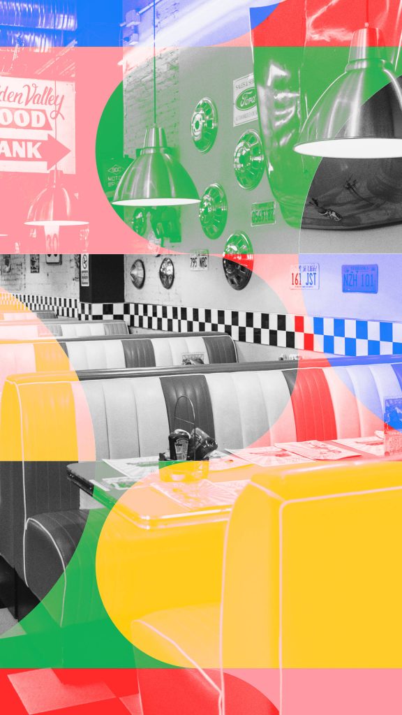 Colorful 80s retro diner wallpaper with vintage black and white booth and vibrant geometric shapes