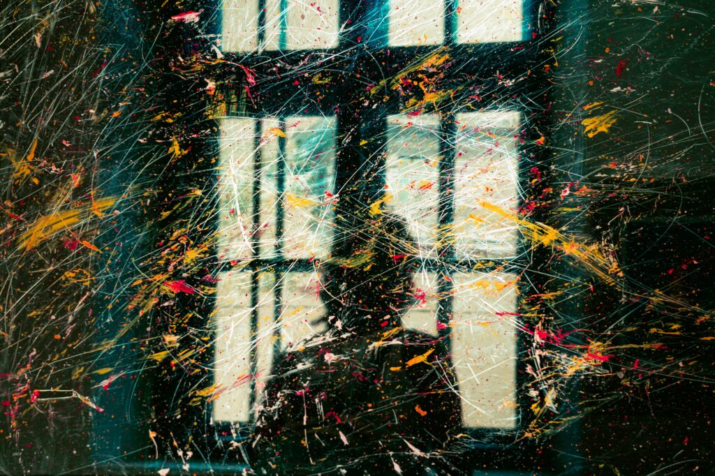 Dynamic Blurred Window Wallpaper with Colorful Paint Splatters