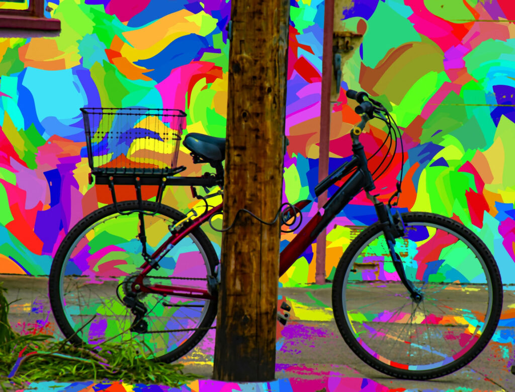 Bicycle leaning on vibrant multicolor abstract wall with bold patterns energetic backdrop wallpaper