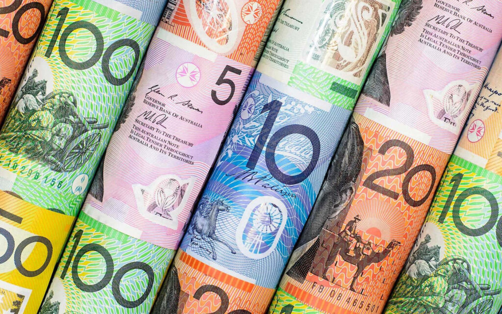 Rolled Australian dollar banknotes vibrant colorful currency designs wallpaper background