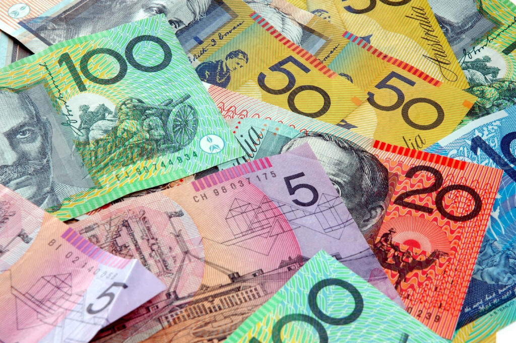 Colorful Australian dollar banknotes spread out showing vibrant currency designs wallpaper background