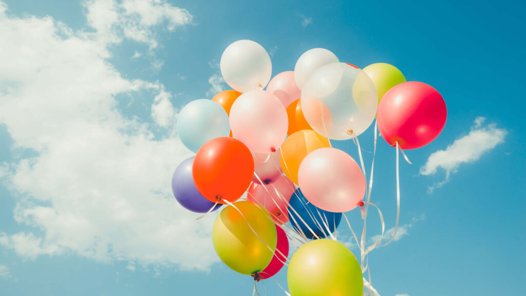 Colorful Balloons Against Bright Blue Sky - Festive Background Wallpaper