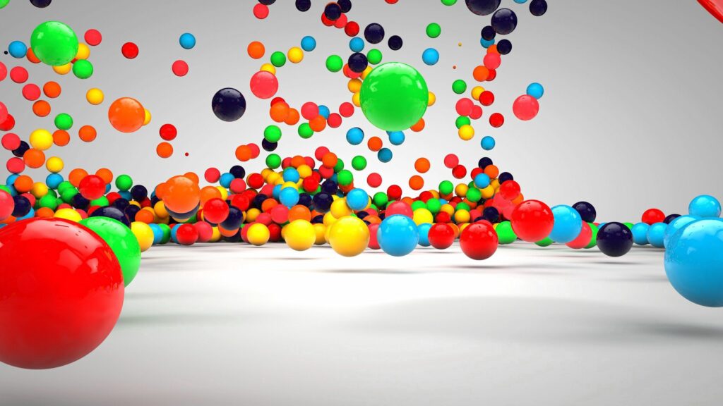 Vibrant Colorful Balls in Mid-Air Wallpaper - 2560x1440 Background