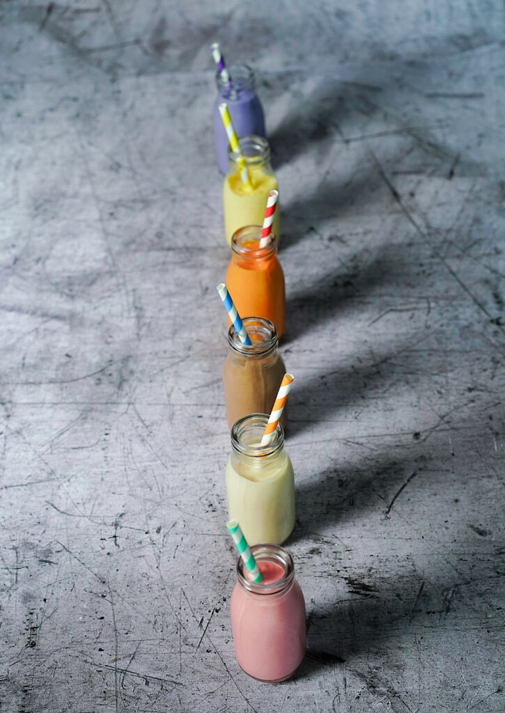 Colorful Beverage Wallpaper: Striped Straws on Gray Background