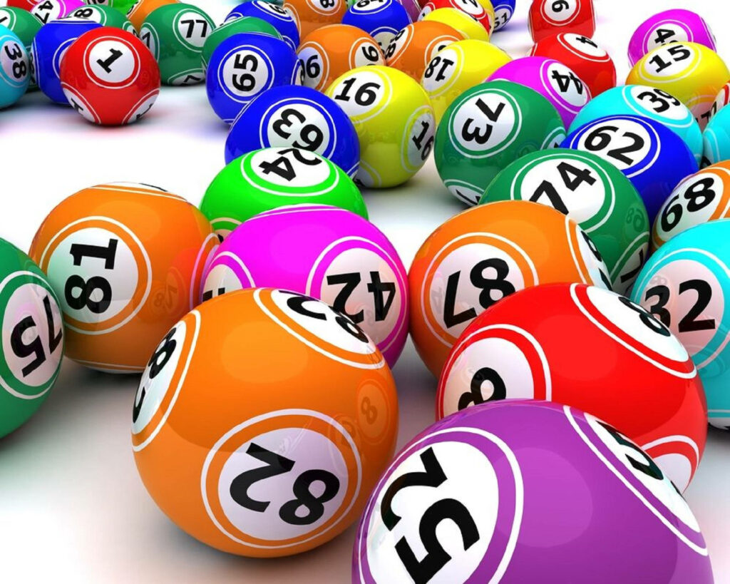 Colorful bingo balls scattered on white background vibrant playful wallpaper design