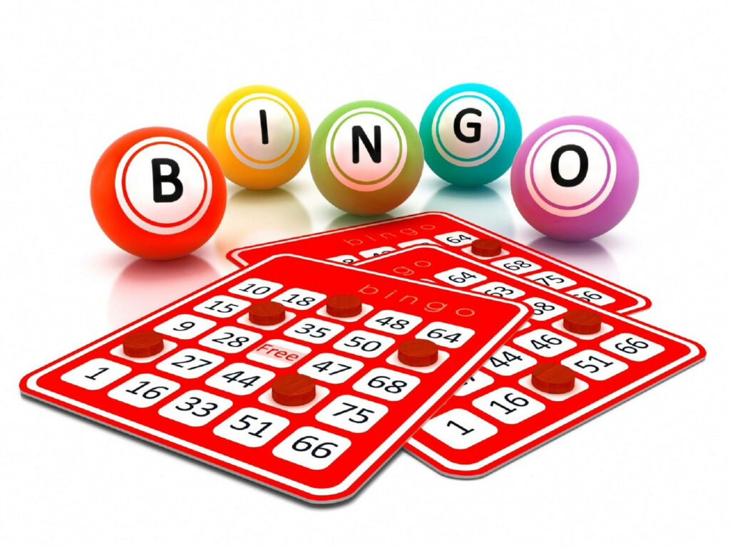 Colorful bingo balls spelling BINGO next to vibrant red bingo cards wallpaper background