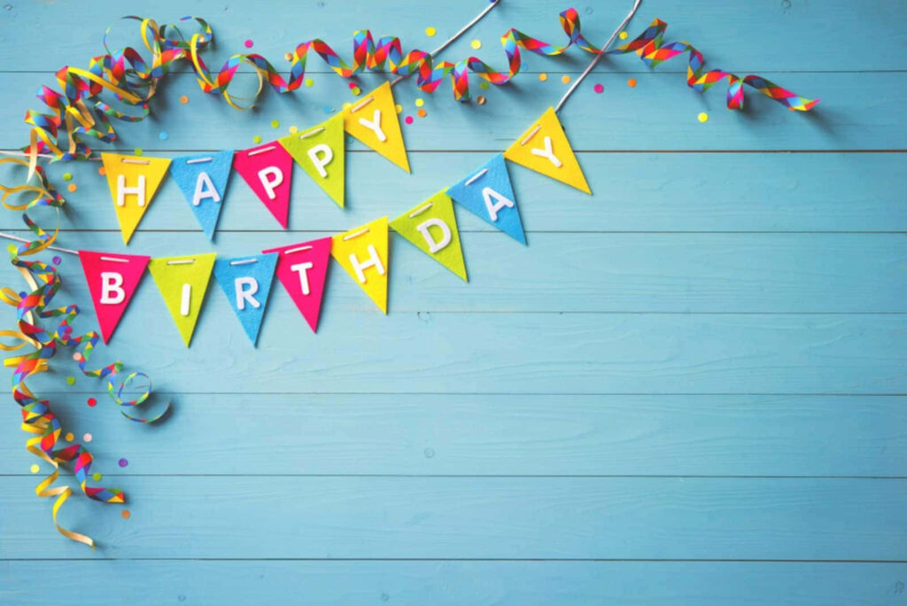 Colorful Birthday Background with Bunting & Confetti on Blue Wood Wallpaper