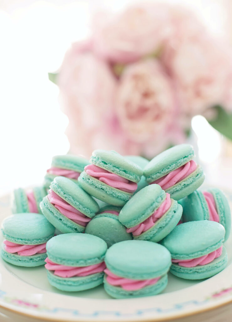 Colorful Blue Macarons Wallpaper with Floral Decor Background