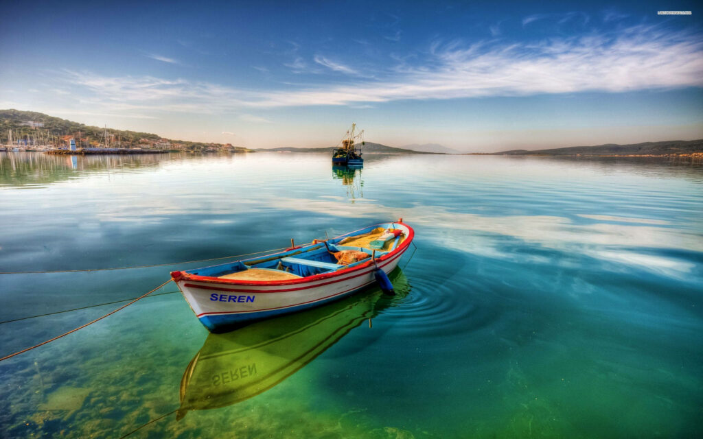 Colorful boat floating on calm green water under clear blue sky serene digital art wallpaper